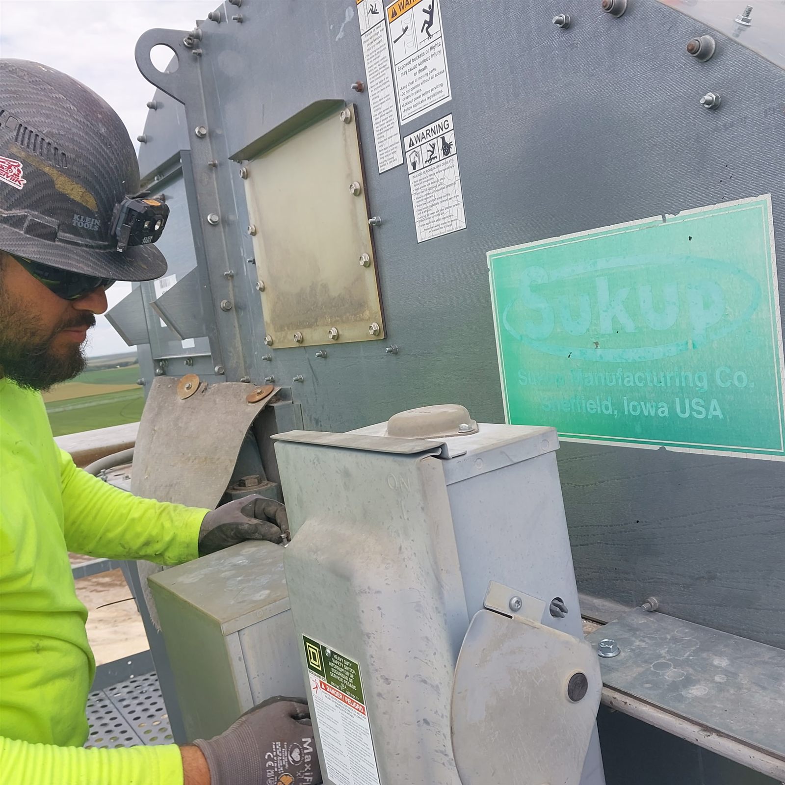 Millwright servicing a Sukup grain leg