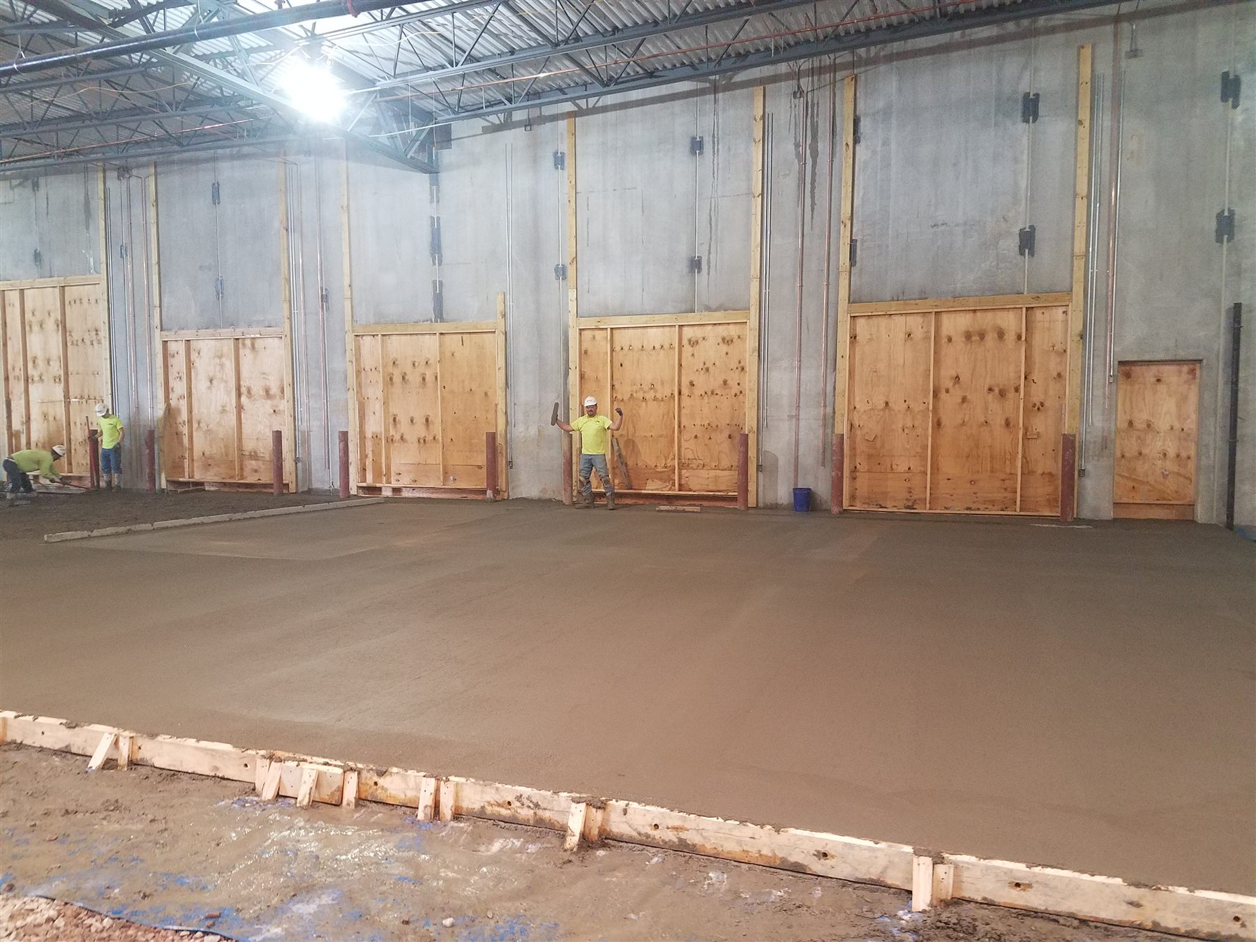 RJ Tide crew finishing an interior concrete flatwork pour