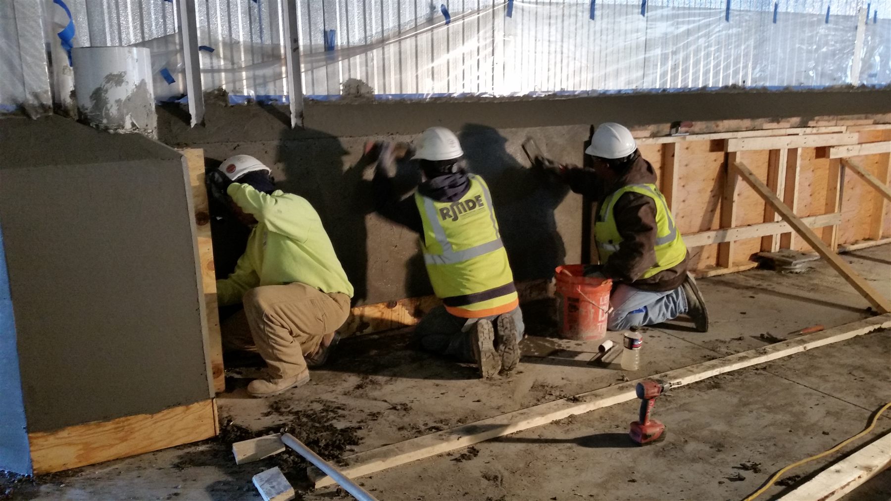 RJ Tide crew finishing an industrial concrete slab