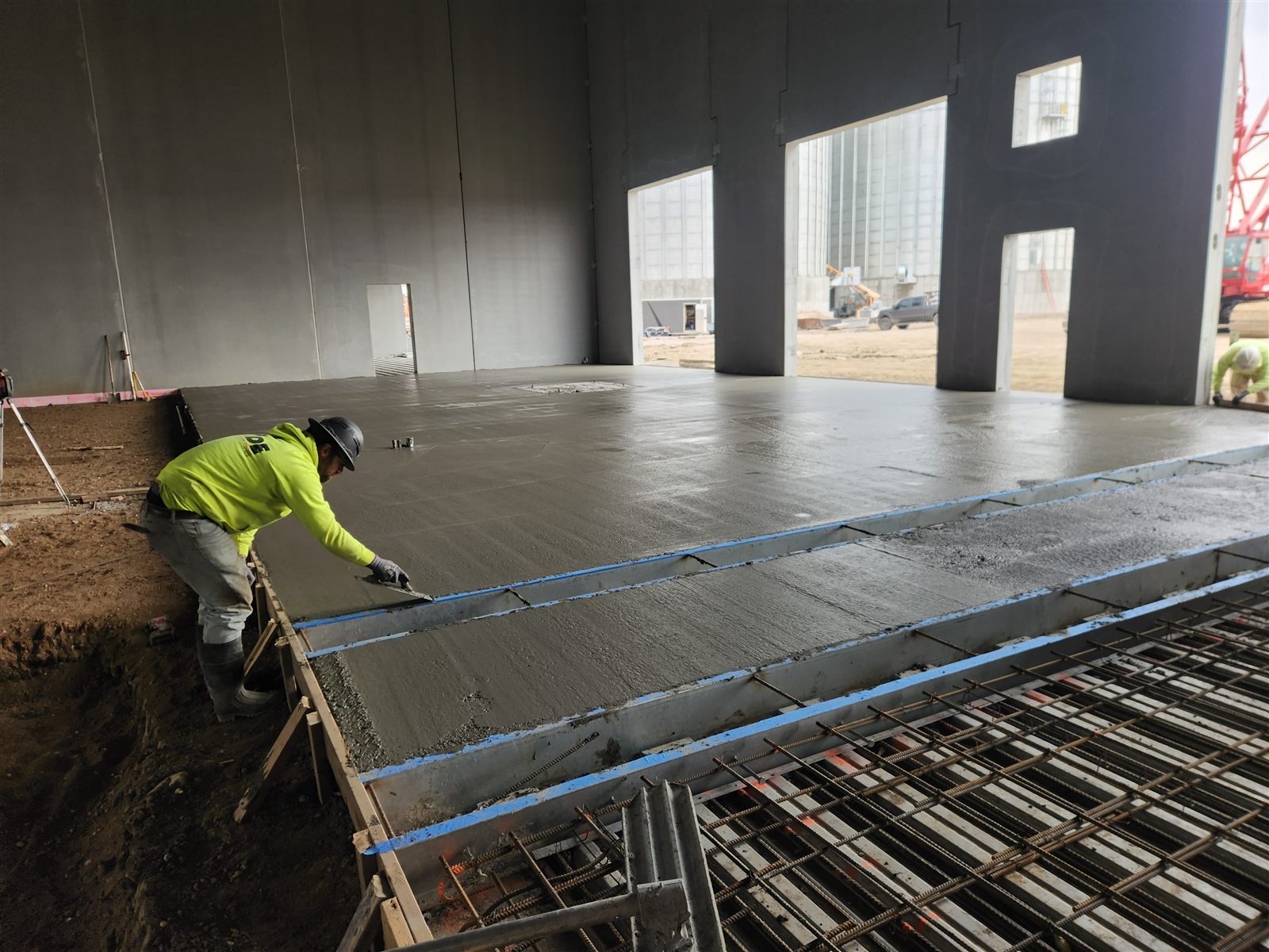 Finishing an interior slab pour beside reinforced sections
