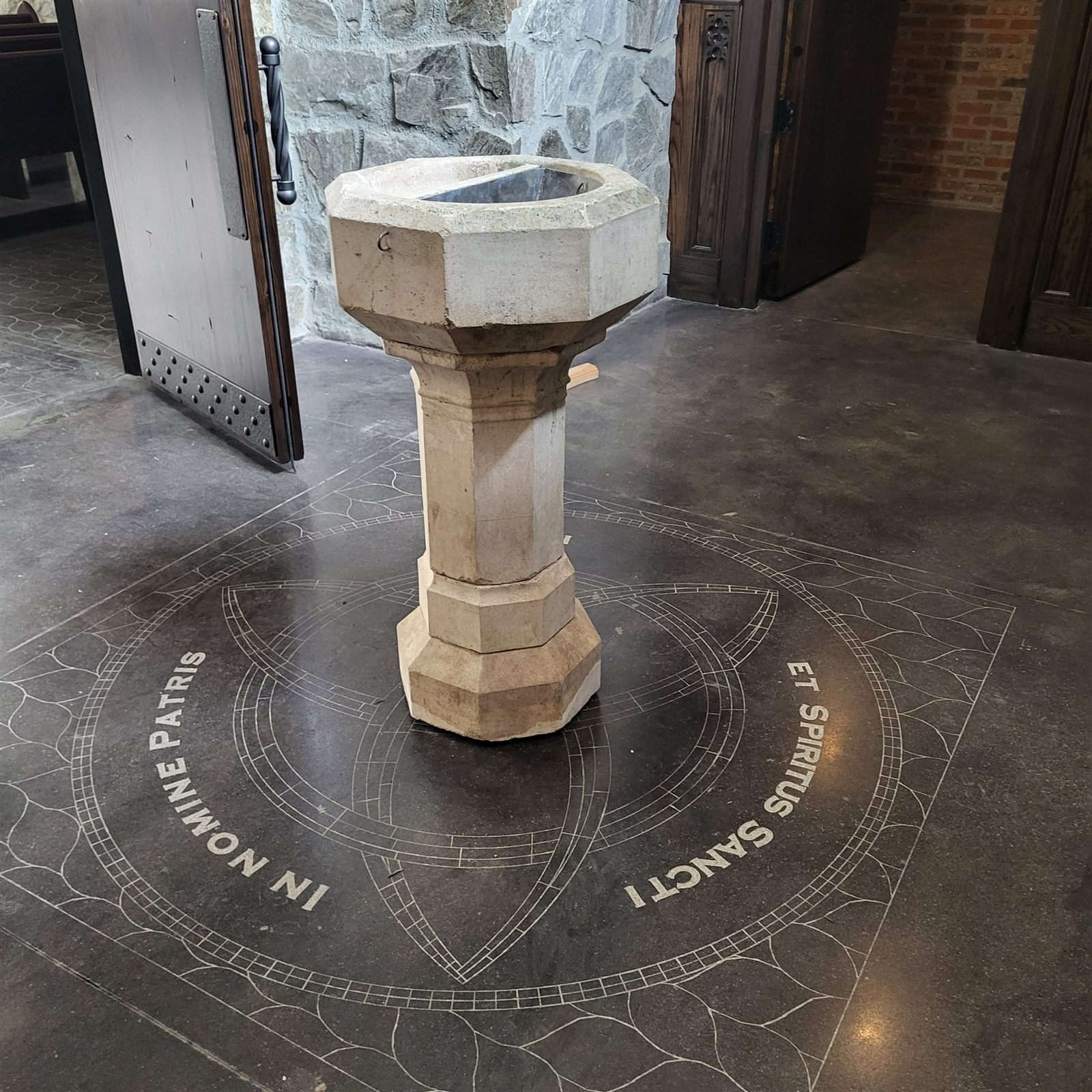 Engraved Decorative Concrete Floor Around a Baptismal Font